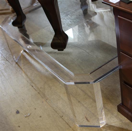 A perspex coffee table